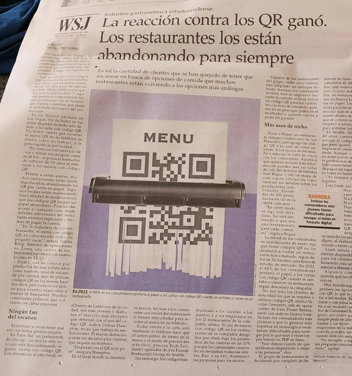 a picture of a news article about QR menus being over